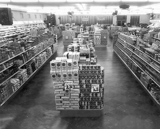 Old picture of inside of a store using Lozier fixtures from 1956