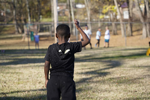 Child playing in yard