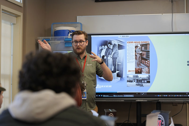 Lozier employee presenting to a class room